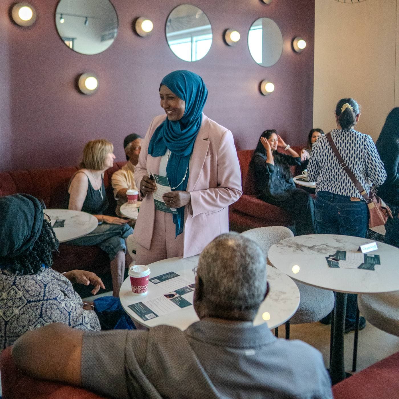 Osob Adus talking with Ward 6 neighbours at the June 6 meet-and-greet.